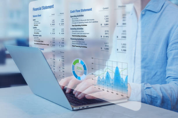Analyzing financial statements and cash flow data on a laptop with interactive digital dashboards